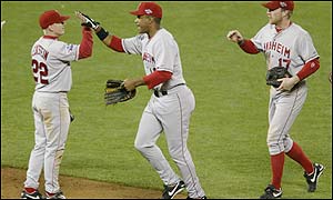 Garret Anderson of the Anaheim Angels celebrates the win in game three