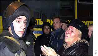 Woman pleads with policeman for information