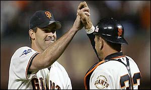 San Francisco Giants pitcher Robb Nen celebrates the win with Benito Santiago