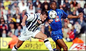 West Bromwich Albion's Phil Gilchrist battles for the ball with Birmingham's Clinton Morrison 