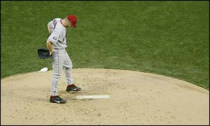 Anaheim pitcher Jarrod Washburn hangs his head after poor pitching gives the Giants the advantage