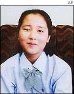 Kim Hye-gyong, 15, poses for a photograph at a hotel in Pyongyang, North Korea, in this family handout photo taken by Japan's government research group, 20 Sept 2002.