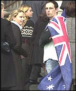 Man draped in Australian flag arrives at St Pauls Cathedral