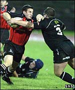 Craig Joiner is held up by Neath's Andrew Milward