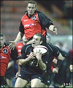 Gareth Morris is about to be caught by Edinburgh's Brendan Laney