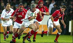 Ulster flanker Neil McMillan attacks for the home side