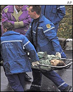 Medics carry an unidentified casualty on a stretcher