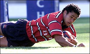 Gloucester's Terry Fanolua goes over to score the opening try 