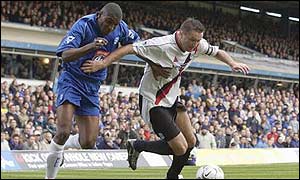Man City's Steve Howey tries to hold off Clinton Morrison