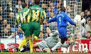Chelsea's Jimmy Floyd Hasselbaink tries to round West Bromich Albion's goalkeeper Russel Hoult 