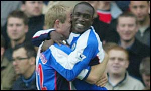 Egil Ostenstad and Dwight Yorke celebrate Rovers' second goal