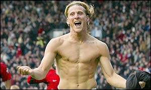Diego Forlan celebrates scoring to rescue a point