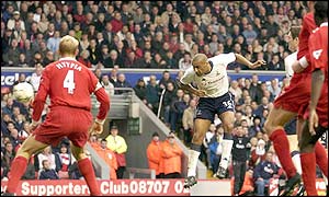 Dean Richards rises high above the Liverpool defence to score