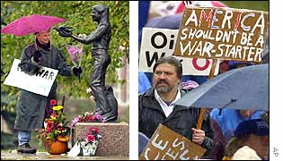 Woman lays flowers by statue of peace activist Samantha Smith (l) while another man marches holding a placard 