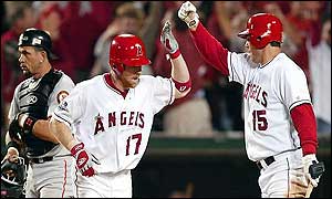 KAnaheim Angels Darin Erstad is congratulated by teammate Tim Salmon after hitting a solo homerun 