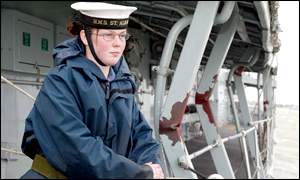 Crew member Kim Davidson surveys the damage on HMS St Albans