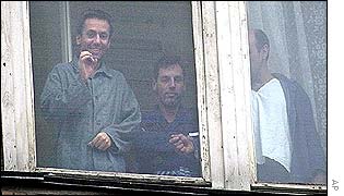 A former hostage at a the window of a Moscow hospital