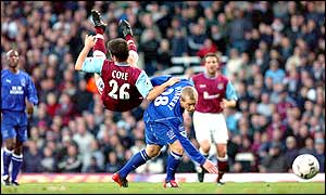 West Ham's Joe Cole is sent flying by a tackle by Everton's Tony Hibbert