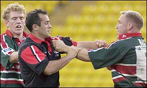 Saracens' Thomas Castaignede and Leicester's Neil back square up