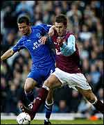 Radzinski battles with Carrick