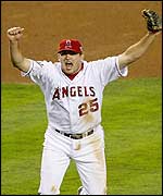 Anaheim Angels' third baseman Troy Glaus celebrates the last out 