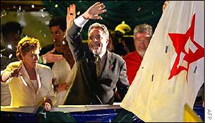 Lula (centre) with his wife Marisa at a rally celebrating his victory