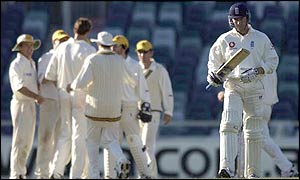 England's Craig White walks back to the pavilion after making just seven runs