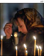 A woman prays in a Moscow church