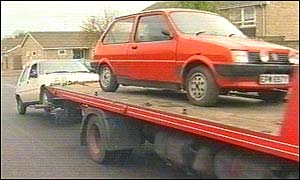 Scrap cars are taken away