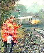 Rail engineers on train tracks