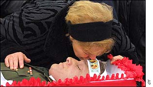 Wife of victim Colonel Konstantin Litvinov kisses dead husband