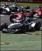Williams driver Juan Pablo Montoya tries a risky manouevre at the first corner of this year's Italian Grand Prix