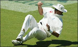 Andy Caddick grasps the ball in his right hand as he catches Mike Hussey 