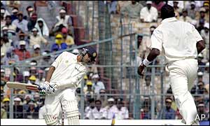 India's Rahul Dravid ducks a ball off Windies paceman Cameron Cuffy 