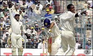 West Indies bowler Jermaine Lawson (right) appeals for a leg-before against India's Virender Sehwag
