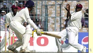 Gayle fails to get to a shot from Parthiv Patel