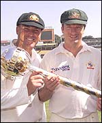Steve Waugh and Shane Warne hold the Test Championship trophy aloft