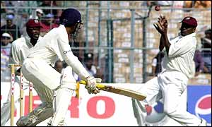 West Indies opener Chris Gayle clings onto a slip catch