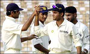 India skipper Sourav Ganguly is congratulated after catching Wavell Hinds off the bowling of Harbhajan