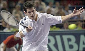 Britain's Tim Henman measures a forehand return