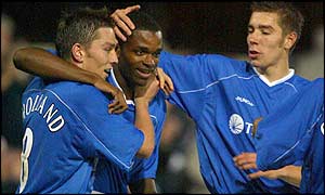 Ipswich goalscorer Darren Bent is flanked by skipper Matt Holland and midfield team-mate Darren Ambrose