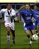 Paris Saint-Germain's Jose da Silva of Paris Saint-Germain chases the ball with FC National Bucharest's Leonard Nemteanu