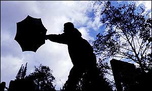 A gust catches an umbrella in London