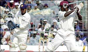 India wicket keeper Parthiv Patel reacts as West Indies opening batsman Chris Gayle hits out