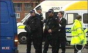 Armed officers carry out one of the stop checks