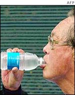Singaporean Prime Minister Goh Chok Tong drinks chilled recycled waste water 
