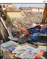 Salvaged books at the site of the school