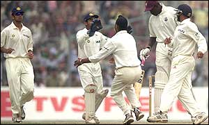 India's Harbhajan Singh (third from left) celebrates with his team-mate Parthiv Patel 