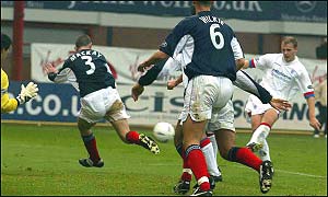 Bob Malcolm drives the ball home for Rangers