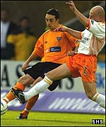 Philippe Brinquin challenges Dunfermline's Gary Dempsey